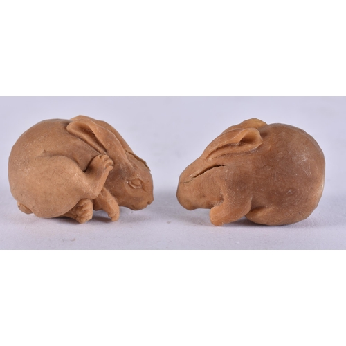 2258 - TWO JAPANESE TAGUA NUT RABBITS. 18 grams. 2.25 cm x 3.25 cm. (2)