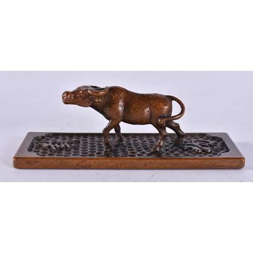 2261 - A JAPANESE BRONZE BULL. 178 grams. 10 cm x 3 cm.