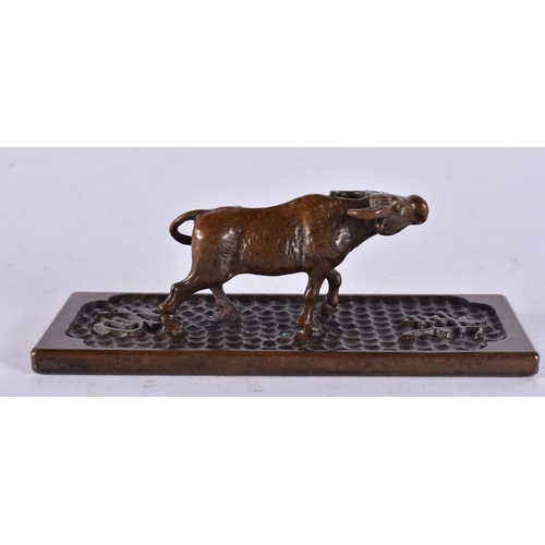 2261 - A JAPANESE BRONZE BULL. 178 grams. 10 cm x 3 cm.