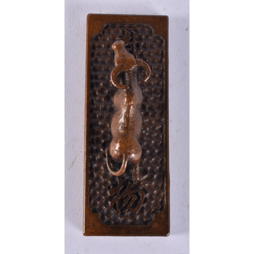 2261 - A JAPANESE BRONZE BULL. 178 grams. 10 cm x 3 cm.