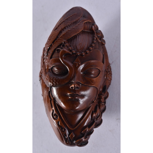 2283 - A JAPANESE WOOD CARVING. 46.6 grams. 8 cm x 4 cm.