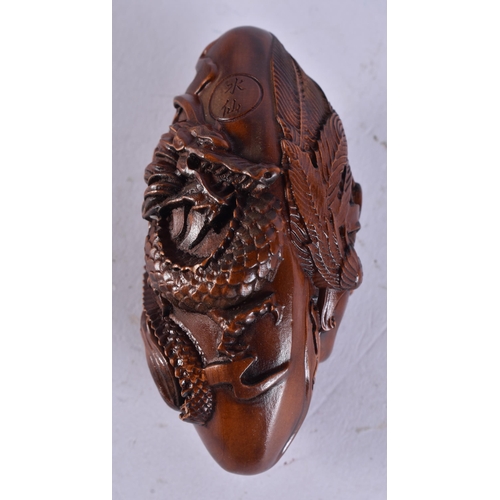 2283 - A JAPANESE WOOD CARVING. 46.6 grams. 8 cm x 4 cm.