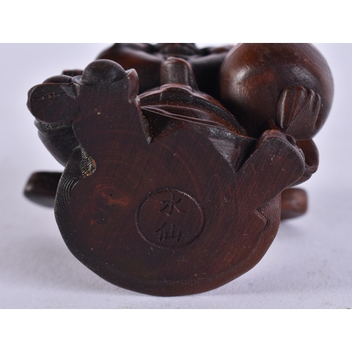 2286 - A JAPANESE WOOD PIG. 30 grams. 5.5 cm x 3.5 cm.
