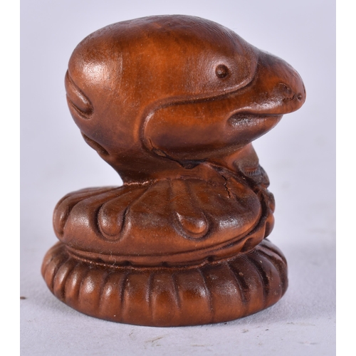 2295 - A JAPANESE WOOD SNAKE. 9.5 grams. 3.25 cm x 3 cm.