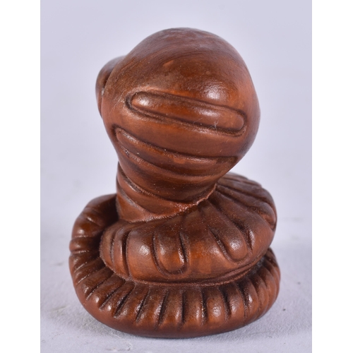 2295 - A JAPANESE WOOD SNAKE. 9.5 grams. 3.25 cm x 3 cm.