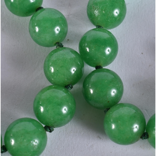 2300 - A CHINESE JADEITE NECKLACE. 152 grams. 86 cm long.