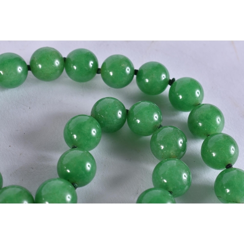 2300 - A CHINESE JADEITE NECKLACE. 152 grams. 86 cm long.