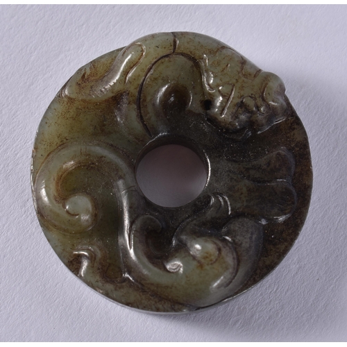 2310 - A CHINESE JADE ROUNDEL. 16 grams. 3.5 cm wide.