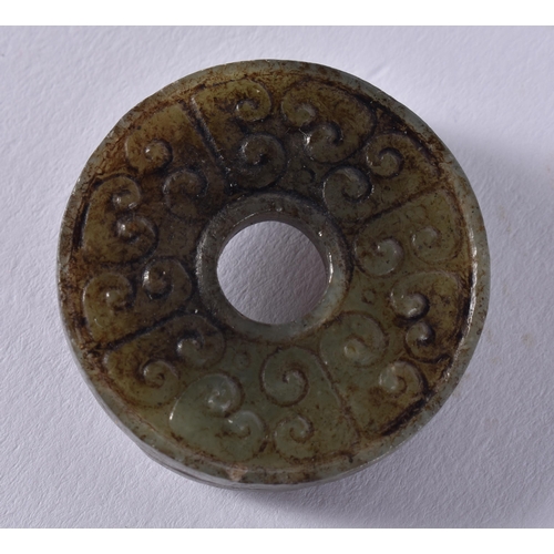 2310 - A CHINESE JADE ROUNDEL. 16 grams. 3.5 cm wide.