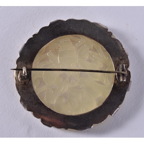 2313 - A CHINESE SILVER AND JADE BROOCH. 22 grams. 5 cm wide.