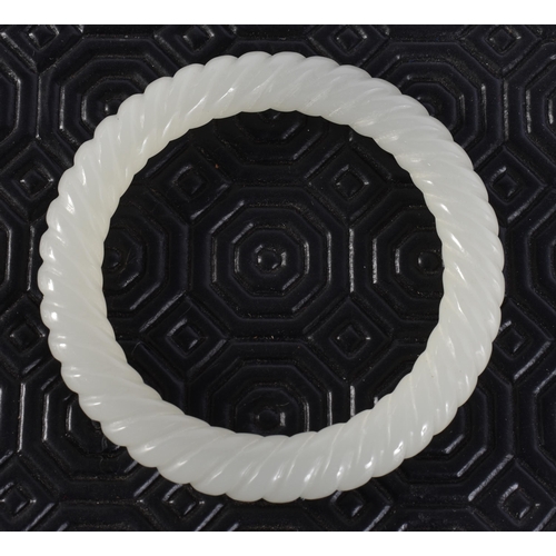 2346 - A CHINESE JADE BANGLE. 44 grams. 6 cm wide.