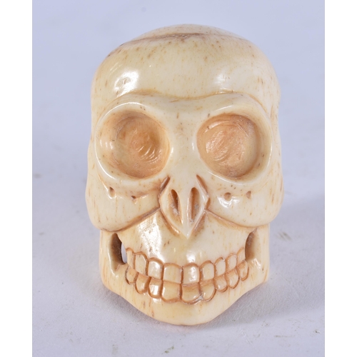 2349 - A JAPANESE BONE SKULL. 26 grams. 4.5 cm x 3.5 cm.