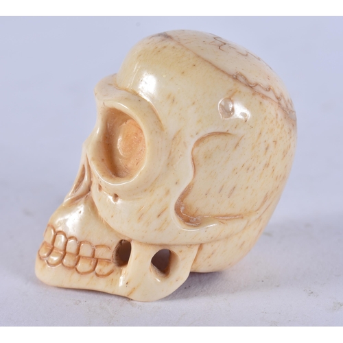 2349 - A JAPANESE BONE SKULL. 26 grams. 4.5 cm x 3.5 cm.