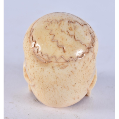 2349 - A JAPANESE BONE SKULL. 26 grams. 4.5 cm x 3.5 cm.