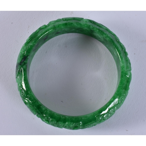 2355 - A CHINESE JADE BANGLE. 67.4 grams. 6 cm wide.