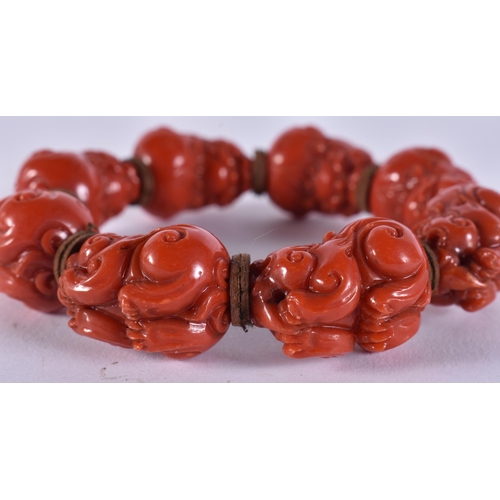 2369 - A CHINESE CORAL NECKLACE and a bracelet. 149 grams. Largest 95 cm long. (2)