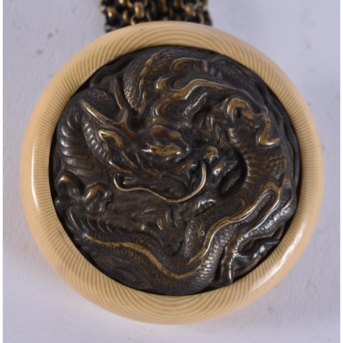 2380 - A 19TH CENTURY JAPANESE MEIJI PERIOD MIXED METAL MANJU NETSUKE. 44.5 grams. 13.25 cm long.