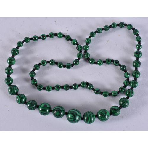 2395 - A CHINESE MALACHITE NECKLACE. 36 grams. 65 cm long.
