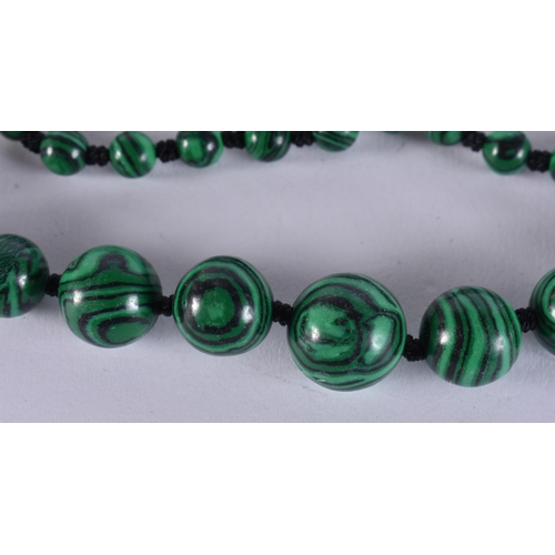 2395 - A CHINESE MALACHITE NECKLACE. 36 grams. 65 cm long.