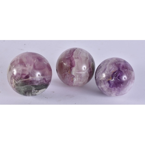 2419 - THREE CHINESE STONE BALLS. 960 grams. 6 cm wide. (3)