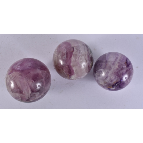 2419 - THREE CHINESE STONE BALLS. 960 grams. 6 cm wide. (3)