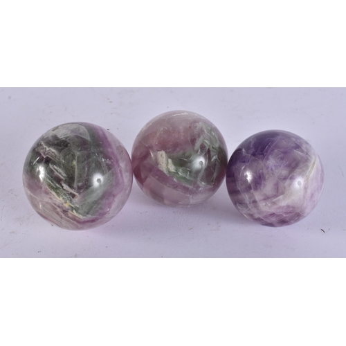 2419 - THREE CHINESE STONE BALLS. 960 grams. 6 cm wide. (3)