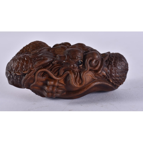 2444 - A JAPANESE CARVED DRAGON. 45 grams. 7.75 cm x 4.5 cm.