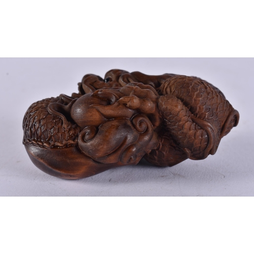 2444 - A JAPANESE CARVED DRAGON. 45 grams. 7.75 cm x 4.5 cm.