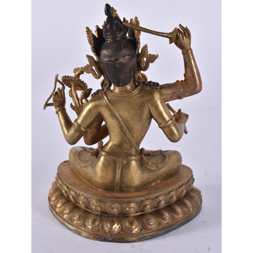 2446 - A CHINESE TIBETAN BRONZE BUDDHA. 501 grams. 10.25 cm x 8 cm.