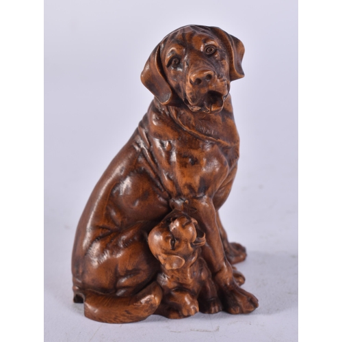 2452 - A JAPANESE CARVED DOG. 63 grams. 8 cm x 5.5 cm.