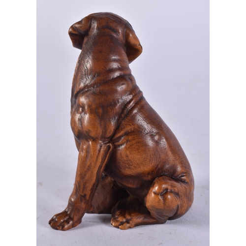 2452 - A JAPANESE CARVED DOG. 63 grams. 8 cm x 5.5 cm.