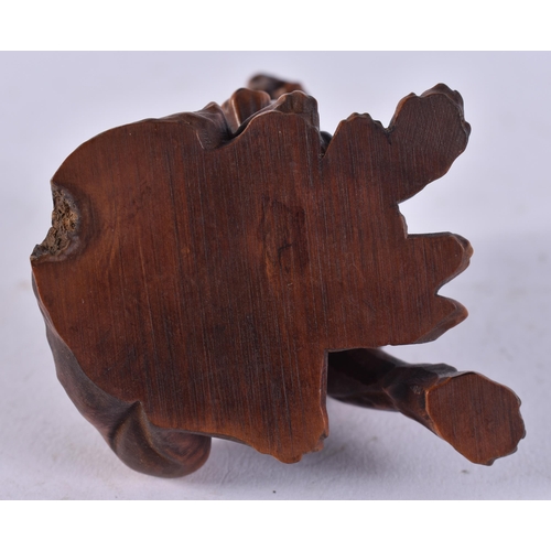 2452 - A JAPANESE CARVED DOG. 63 grams. 8 cm x 5.5 cm.