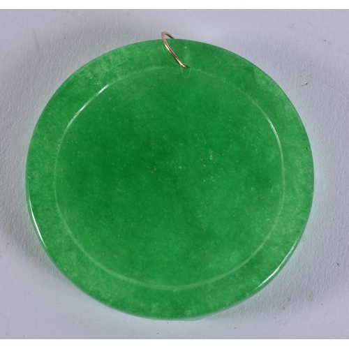 2478 - A CHINESE GOLD MOUNTED JADE PENDANT. 35.7 grams. 5.5 cm wide.