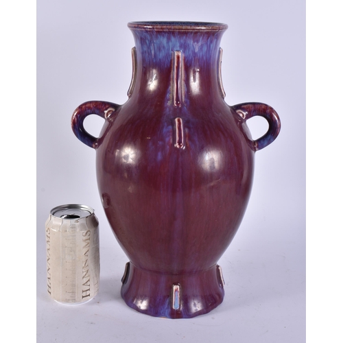 2482 - A LARGE CHINESE FLAMBE GLAZED TWIN HANDLED PORCELAIN VASE. 33 cm x 20 cm.