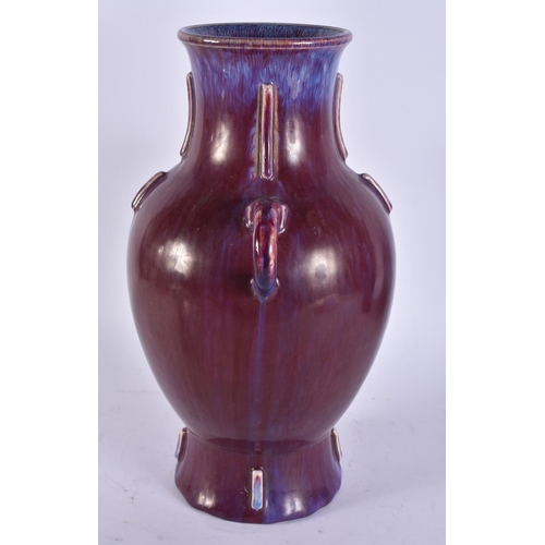 2482 - A LARGE CHINESE FLAMBE GLAZED TWIN HANDLED PORCELAIN VASE. 33 cm x 20 cm.