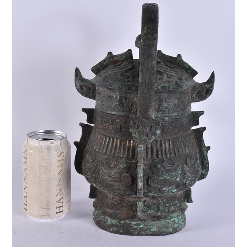 2483 - A RARE CHINESE QING DYNASTY BRONZE SWING HANDLED VESSEL AND COVER. 29 cm high inc handle.