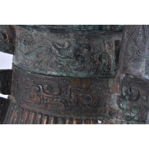 2483 - A RARE CHINESE QING DYNASTY BRONZE SWING HANDLED VESSEL AND COVER. 29 cm high inc handle.