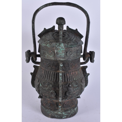 2483 - A RARE CHINESE QING DYNASTY BRONZE SWING HANDLED VESSEL AND COVER. 29 cm high inc handle.