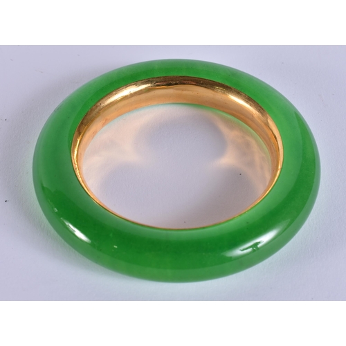 2517 - A CHINESE YELLOW METAL JADE BANGLE. 118.6 grams. 8 cm wide.