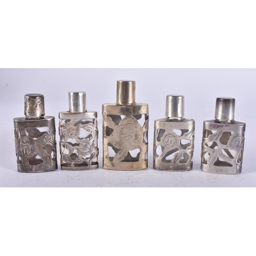 2579 - FIVE SILVER OVERLAID SCENT BOTTLES. 101 grams overall. 6.25 cm high. (5)
