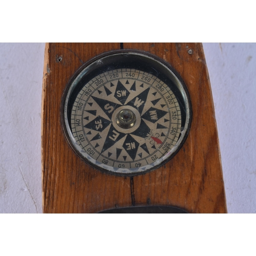 AN UNUSUAL BOAT SHAPED COMPASS. 17 cm long.