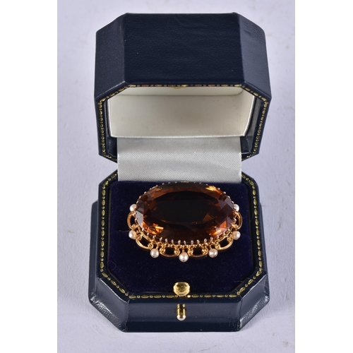 2613 - AN 18CT GOLD CITRINE BROOCH. 18.4 grams. 2.75 cm x 3.5 cm.