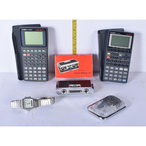 3011 - A vintage metal handheld metal pocket warmer together with 2 Casio 7700GH calculators a Seiko pocket... 