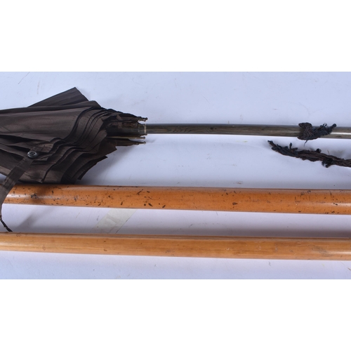 3012 - Two walking canes one with an embossed silver handle together with a vintage parasol   83cm (3)