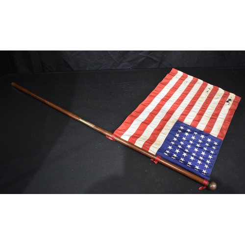 3013 - A vintage American flag with wooden pole possibly for maritime use 104cm