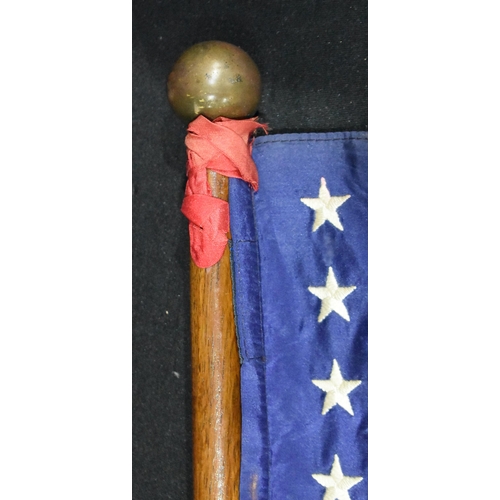 3013 - A vintage American flag with wooden pole possibly for maritime use 104cm