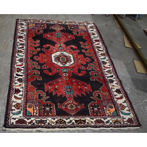 3024 - A hand made Iranian Heriz wool rug 208 x 131 cm