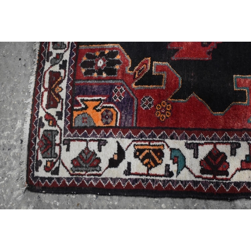 3024 - A hand made Iranian Heriz wool rug 208 x 131 cm