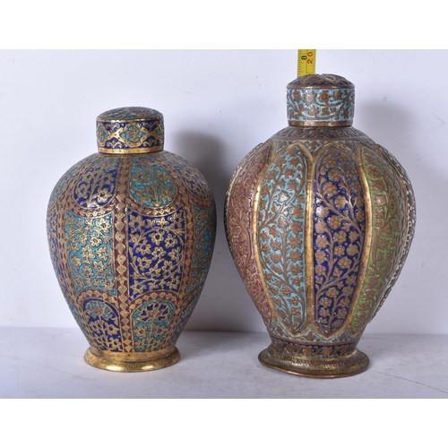 3026 - A near pair of Persian gilt metal and enamelled vases decorated with floral pattern 19cm (2)