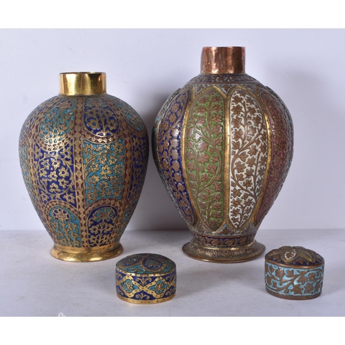 3026 - A near pair of Persian gilt metal and enamelled vases decorated with floral pattern 19cm (2)